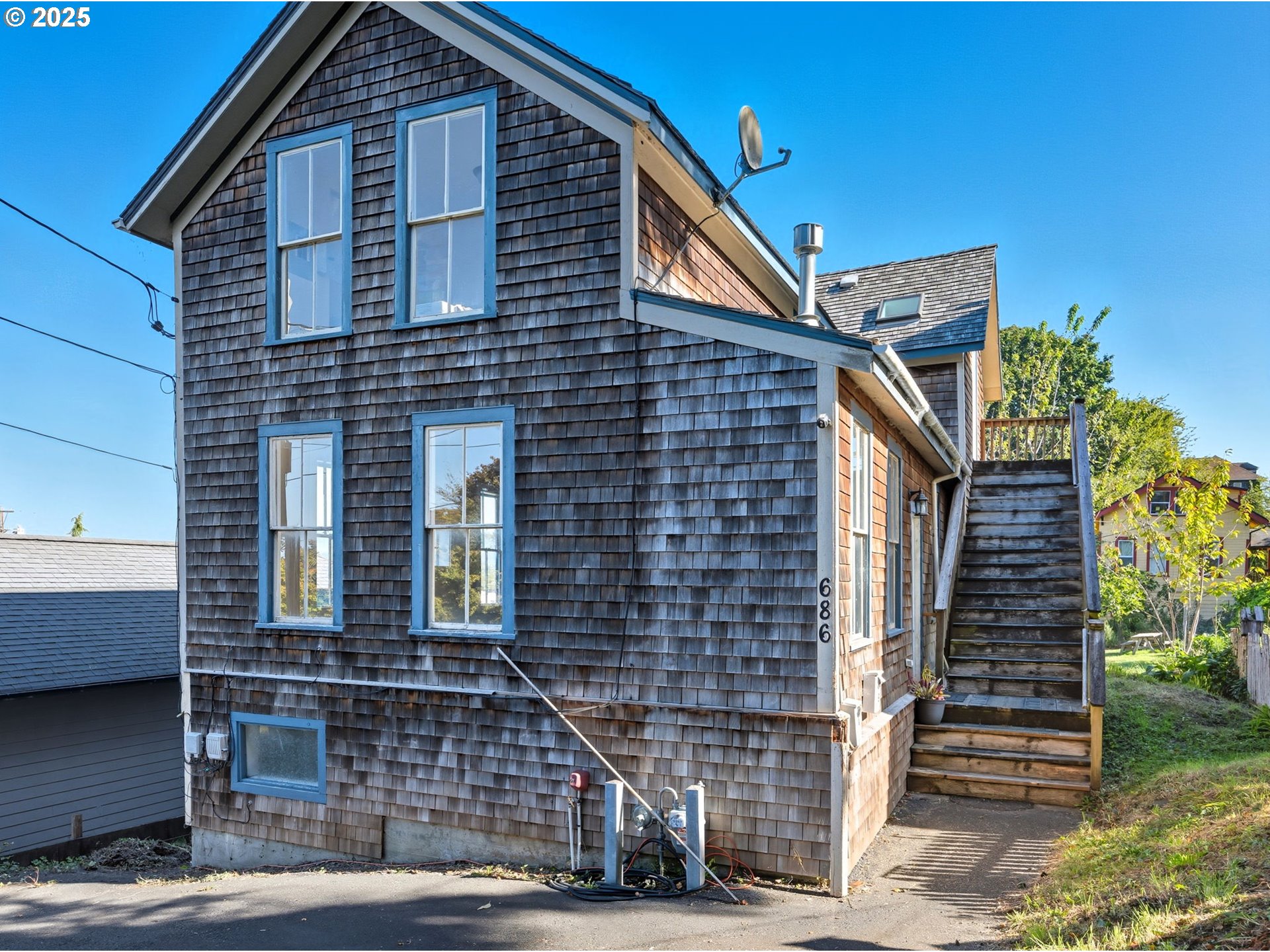 686 29th Street Astoria, OR 97103 - Photo 2 of 48 a front view of a house with a yard