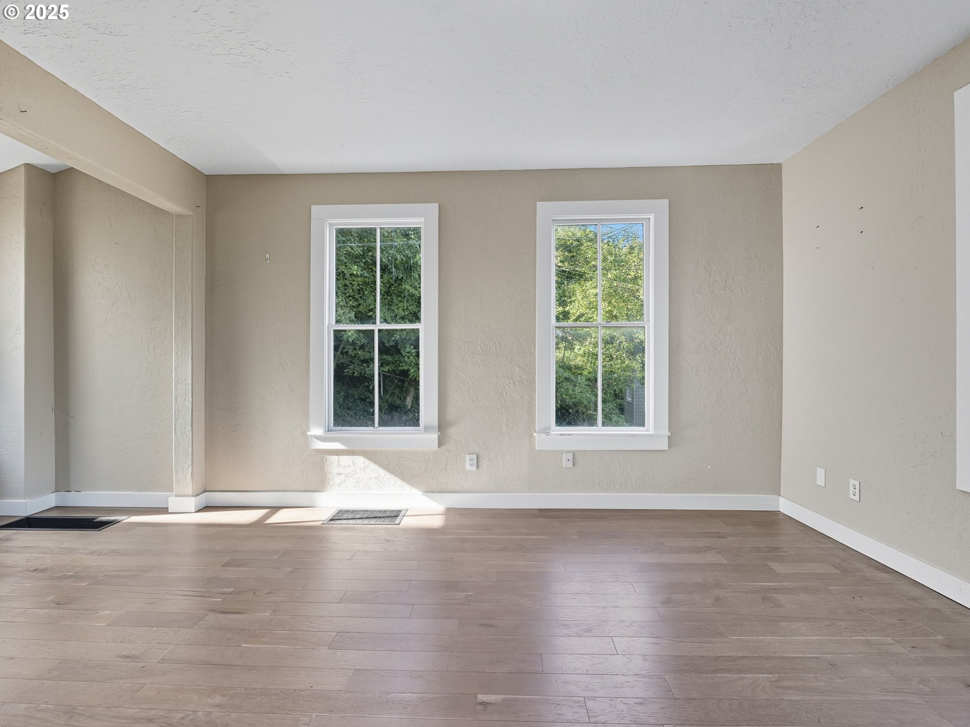 686 29th Street Astoria, OR 97103 - Photo 22 of 48 a view of wooden floor and windows in a room