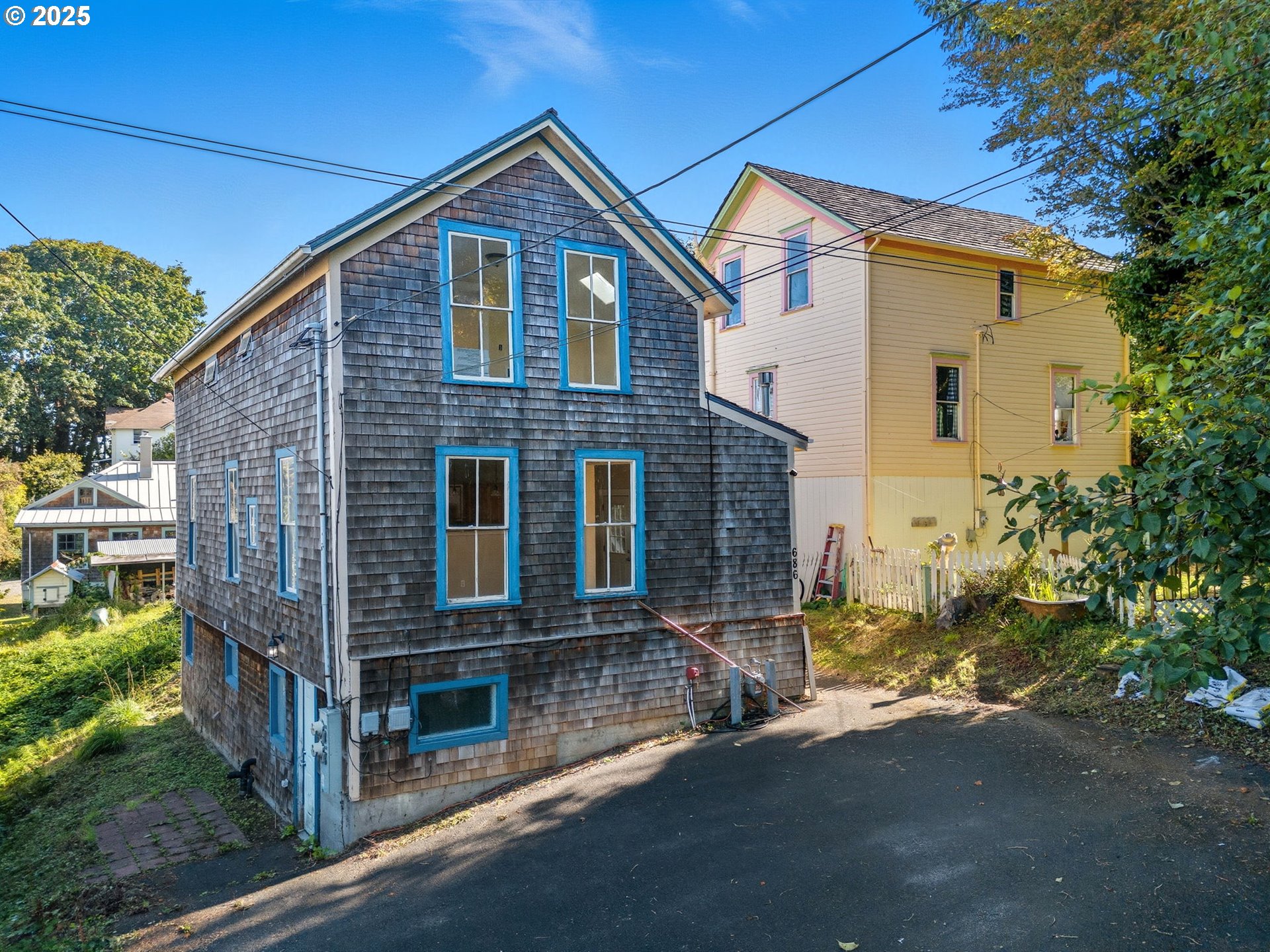 686 29th Street Astoria, OR 97103 - Photo 3 of 48 a front view of a house with a yard