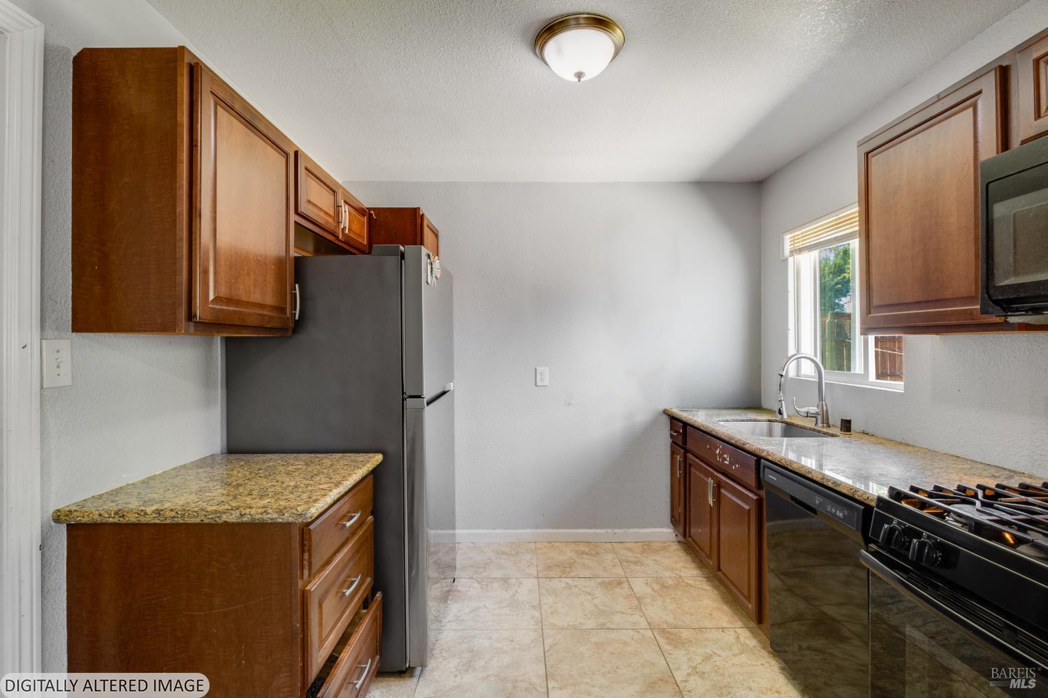 1722 Indiana Street Fairfield, CA 94533 - Photo 11 of 18 a kitchen with stainless steel appliances granite countertop a stove and a refrigerator
