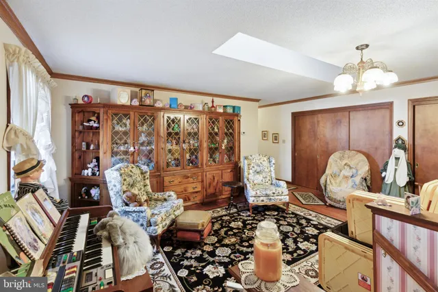 a bedroom with a bed and a large mirror with a flat tv screen