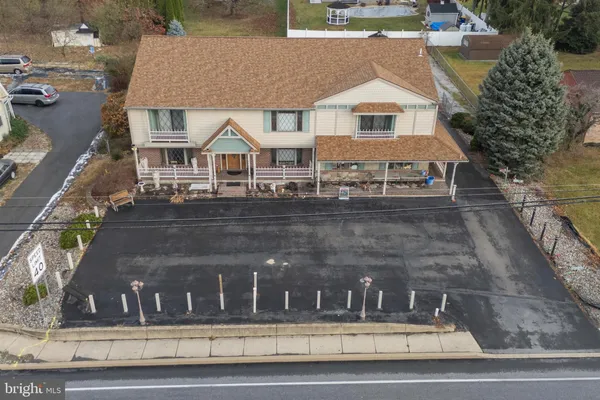 a view of a large building next to a road