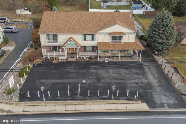 a view of a large building next to a road