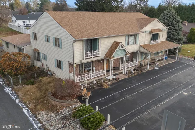 an aerial view of a house with a garden space