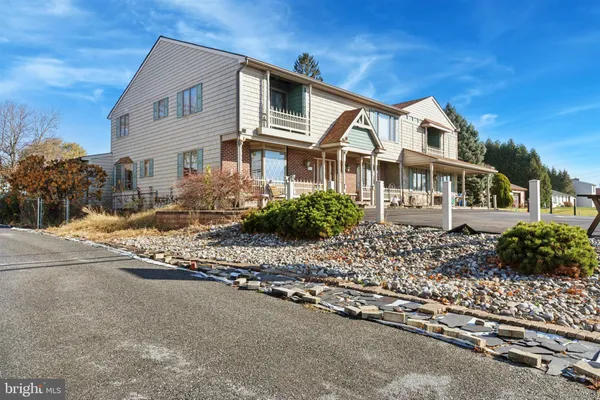a view of a balcony with blue and white wooden fence