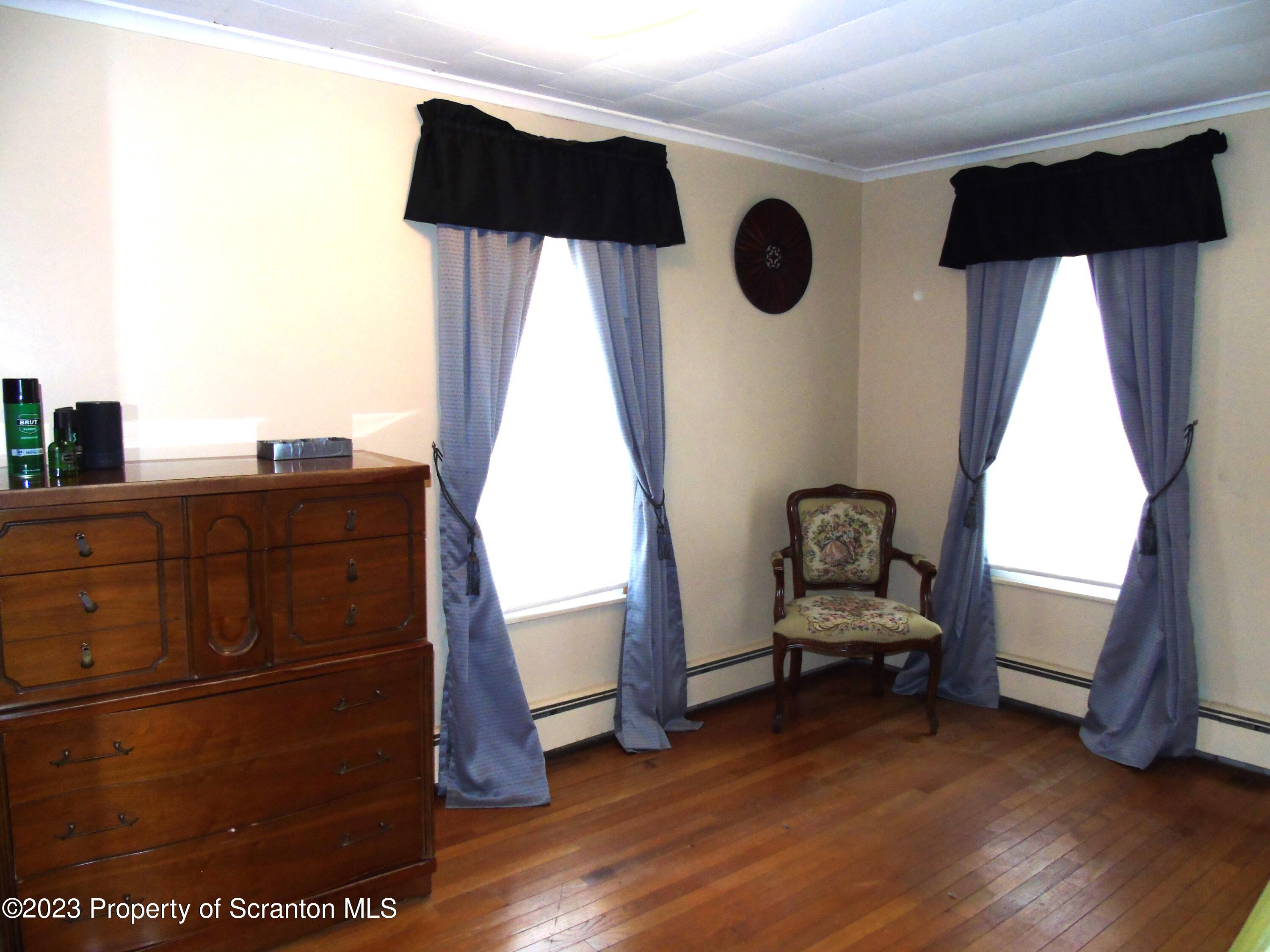 115 T Rte 718 Moscow, PA 18444 - Photo 21 of 26 a view of living room with furniture and wooden floor