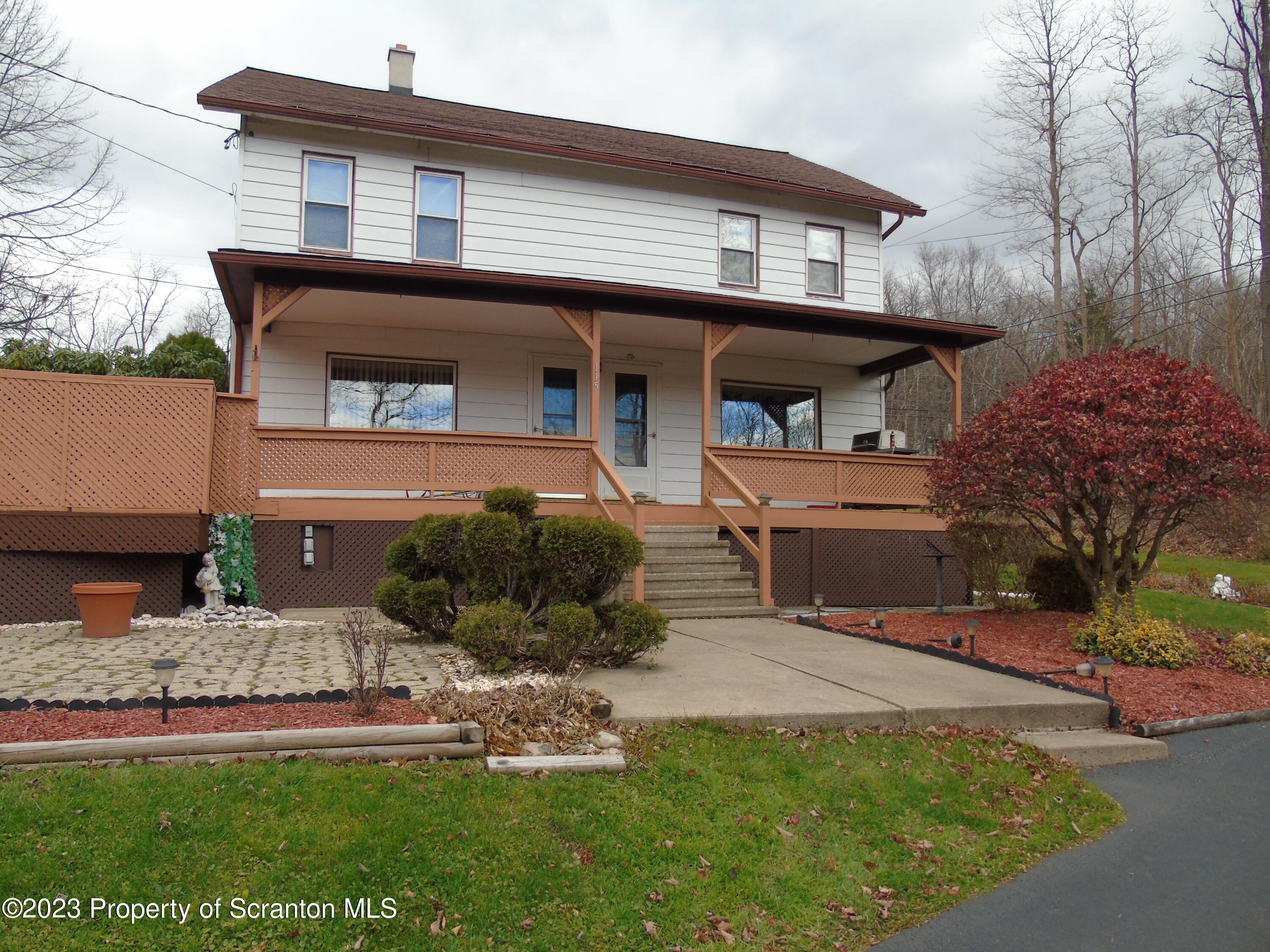 115 T Rte 718 Moscow, PA 18444 - Photo 3 of 26 a front view of a house with a yard