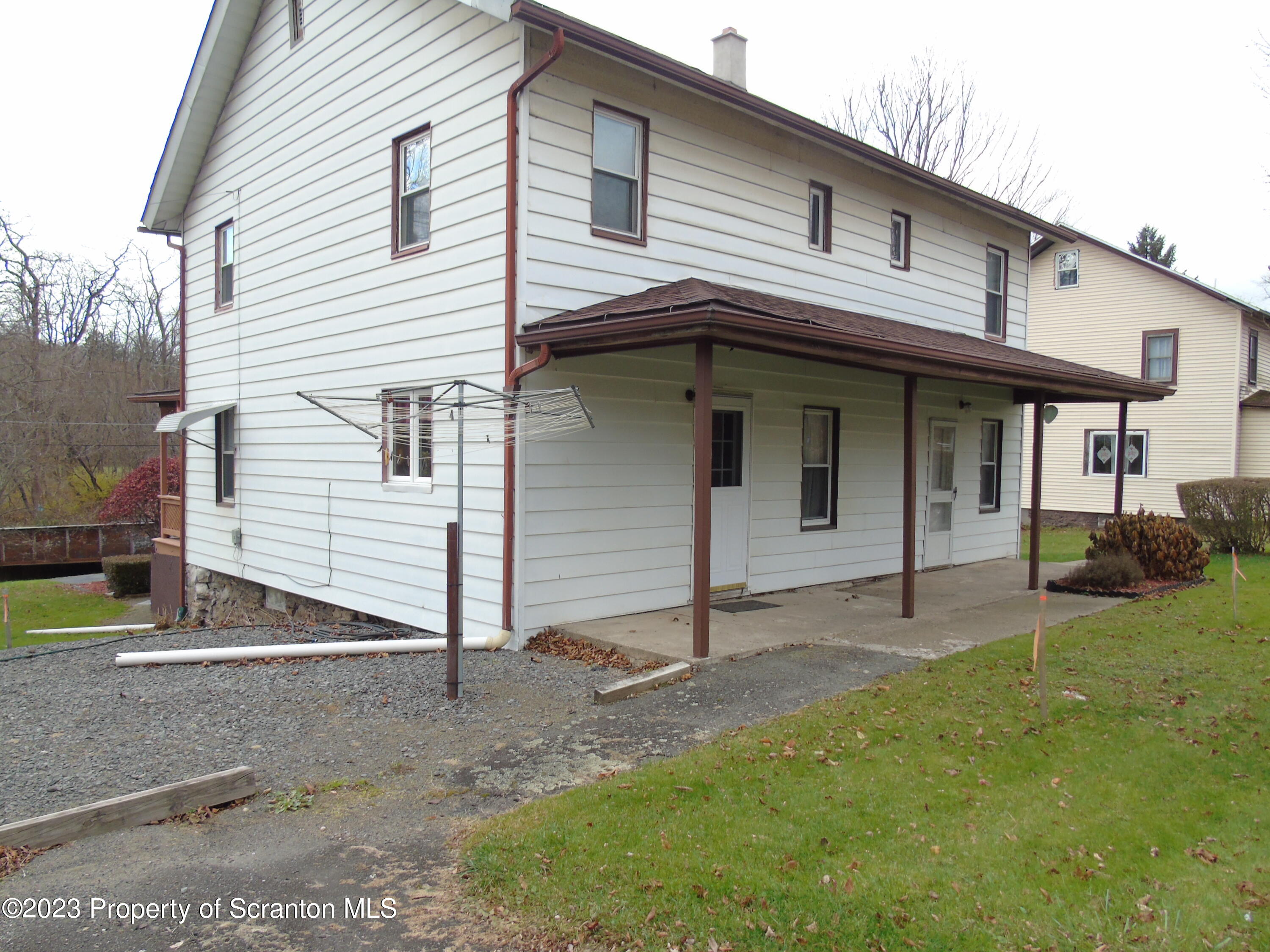 115 T Rte 718 Moscow, PA 18444 - Photo 7 of 26 a view of a white house