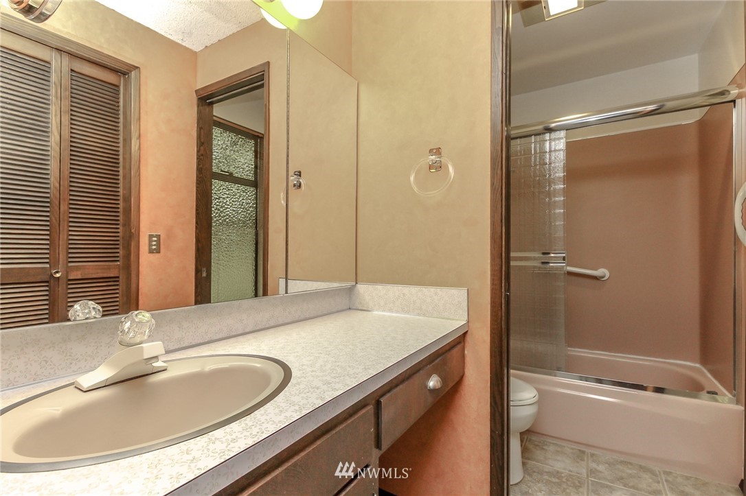 4615 Northeast 24th Street Renton, WA 98059 - Photo 30 of 40 a bathroom with a sink and a mirror