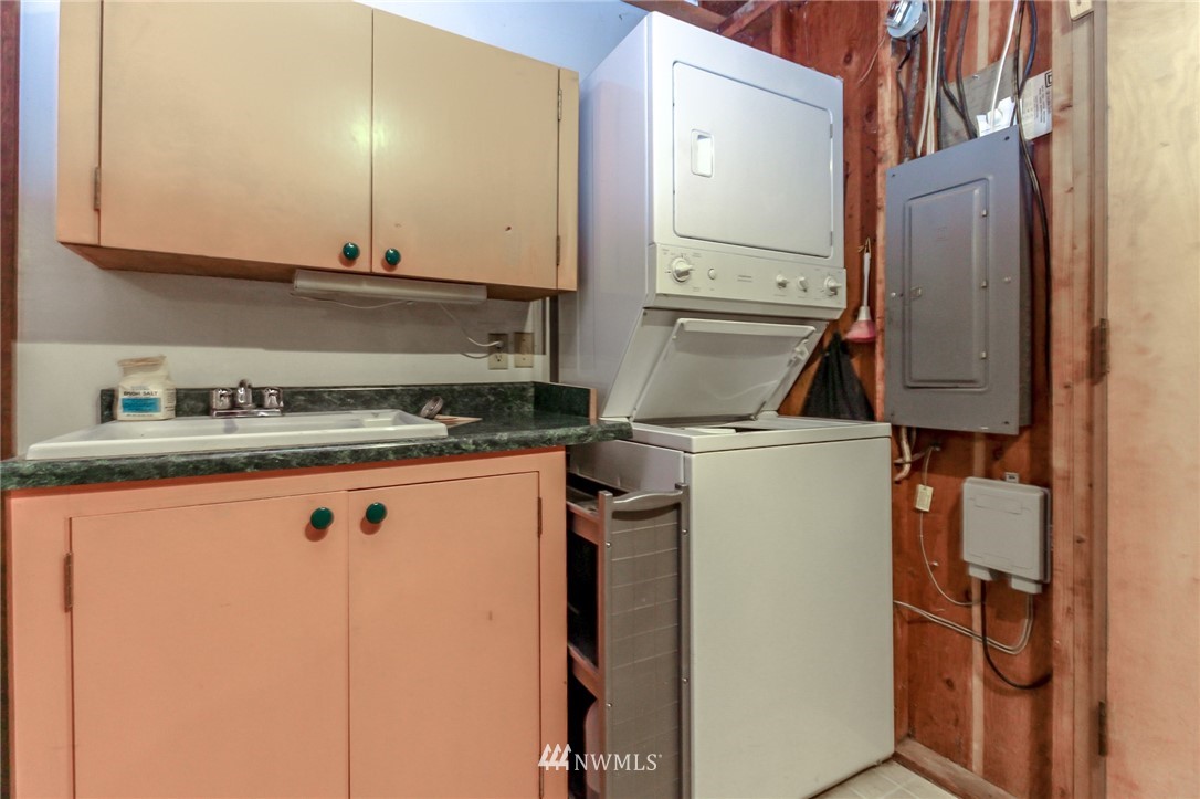 4615 Northeast 24th Street Renton, WA 98059 - Photo 32 of 40 a kitchen with a refrigerator and cabinets