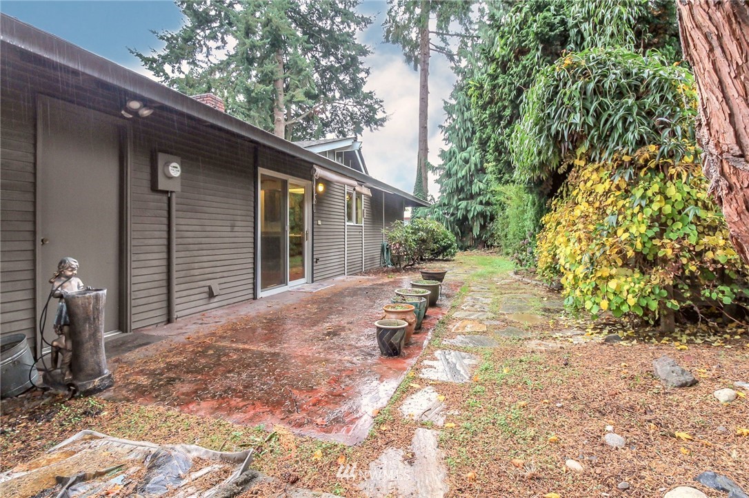 4615 Northeast 24th Street Renton, WA 98059 - Photo 34 of 40 a view of a backyard with a small cabin