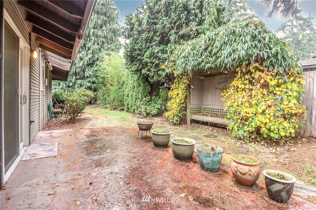 4615 Northeast 24th Street Renton, WA 98059 - Photo 35 of 40 a view of a backyard with table and chairs and potted plants