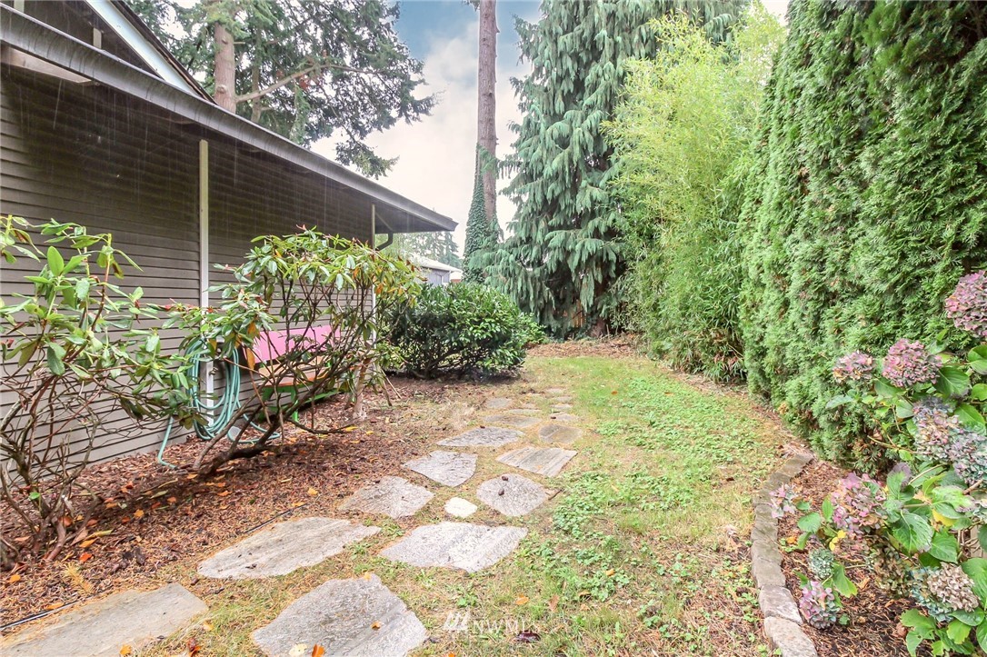 4615 Northeast 24th Street Renton, WA 98059 - Photo 36 of 40 a backyard of a house with lots of green space and garden
