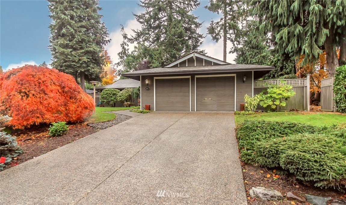 4615 Northeast 24th Street Renton, WA 98059 - Photo 39 of 40 a front view of a house with a garden