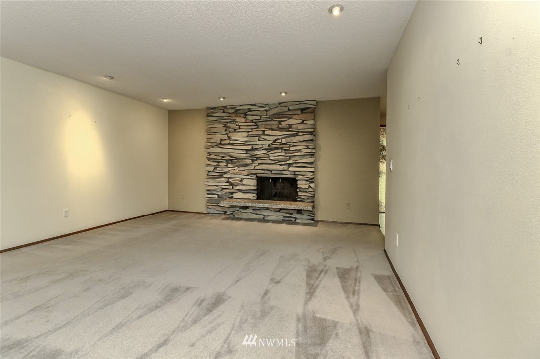 4615 Northeast 24th Street Renton, WA 98059 - Photo 7 of 40 a view of empty room with fireplace