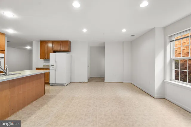 a view of a big room with windows and cabinet