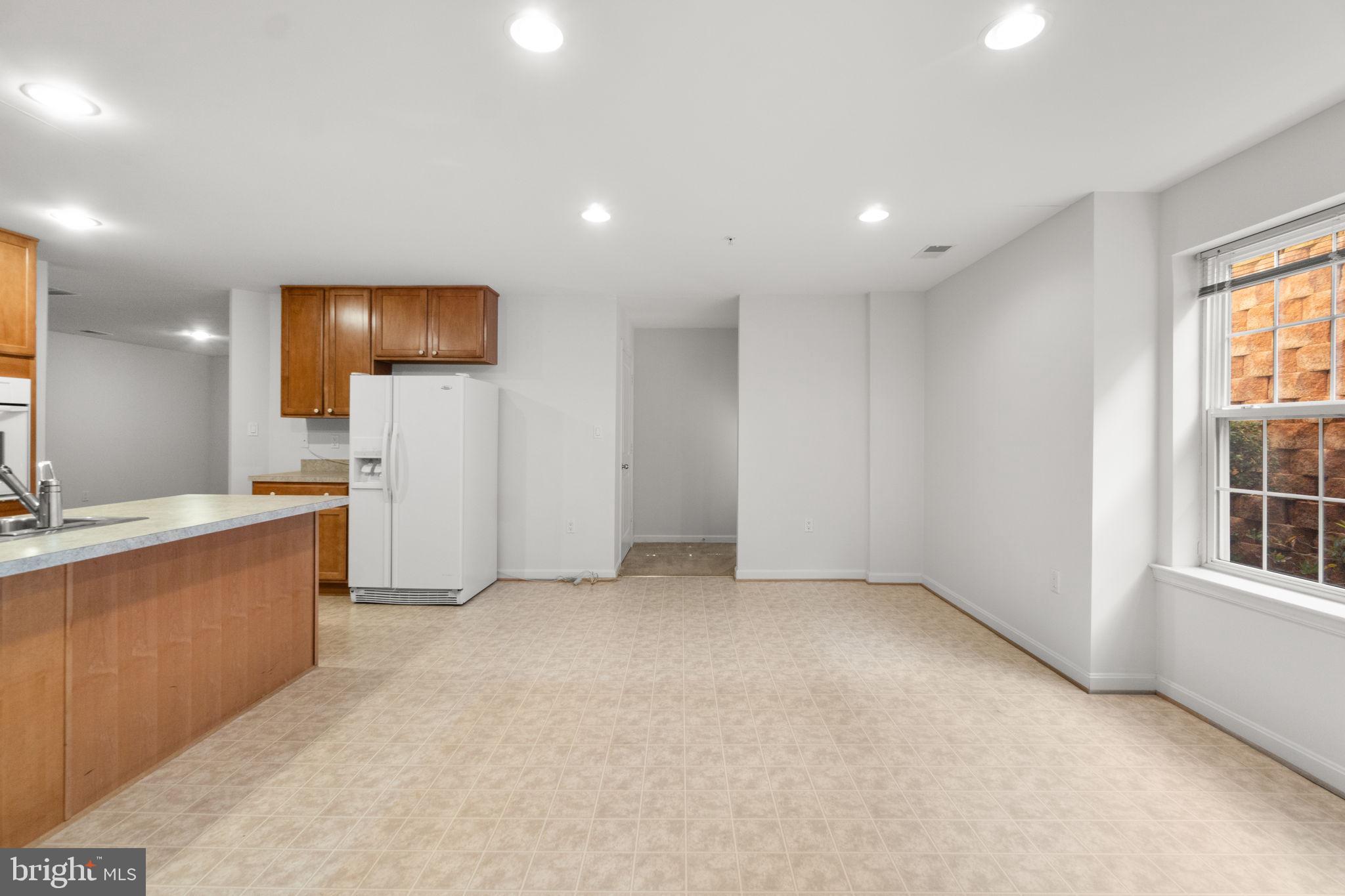 9510 Coyle Road, Unit 109 Owings Mills, MD 21117 - Photo 13 of 41 a view of a big room with windows and cabinet
