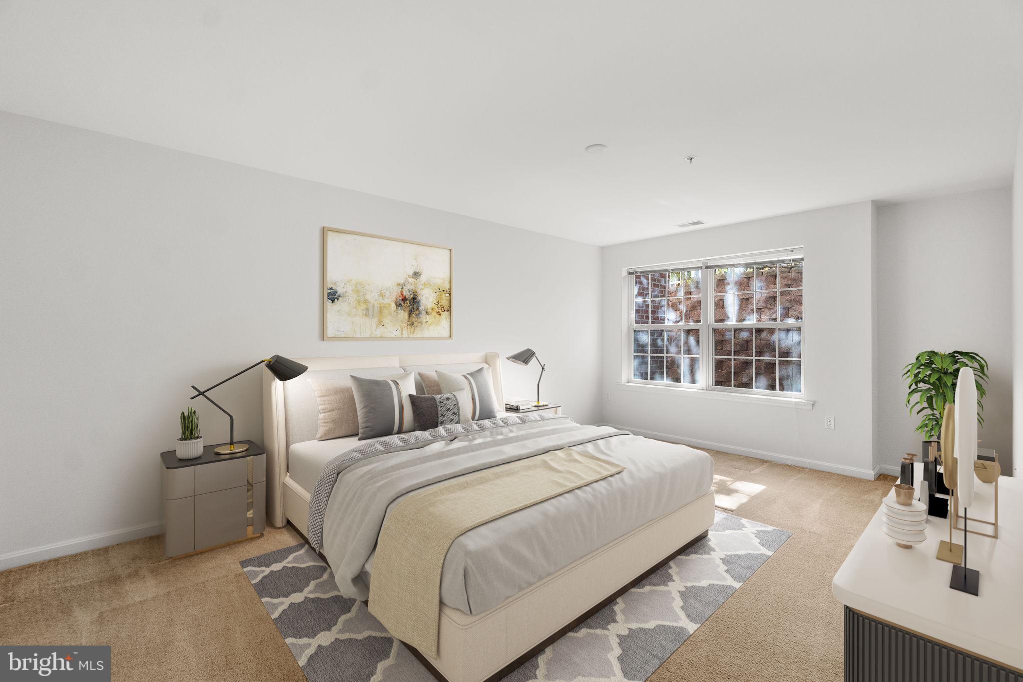 9510 Coyle Road, Unit 109 Owings Mills, MD 21117 - Photo 20 of 41 a bedroom with bed and a window