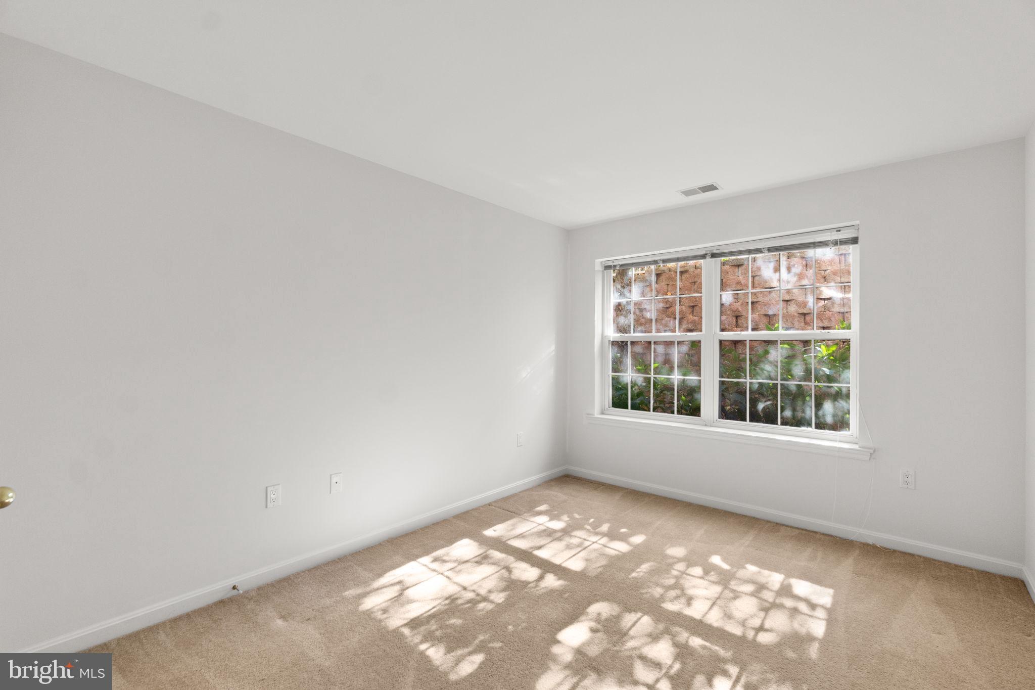9510 Coyle Road, Unit 109 Owings Mills, MD 21117 - Photo 28 of 41 an empty room with a window