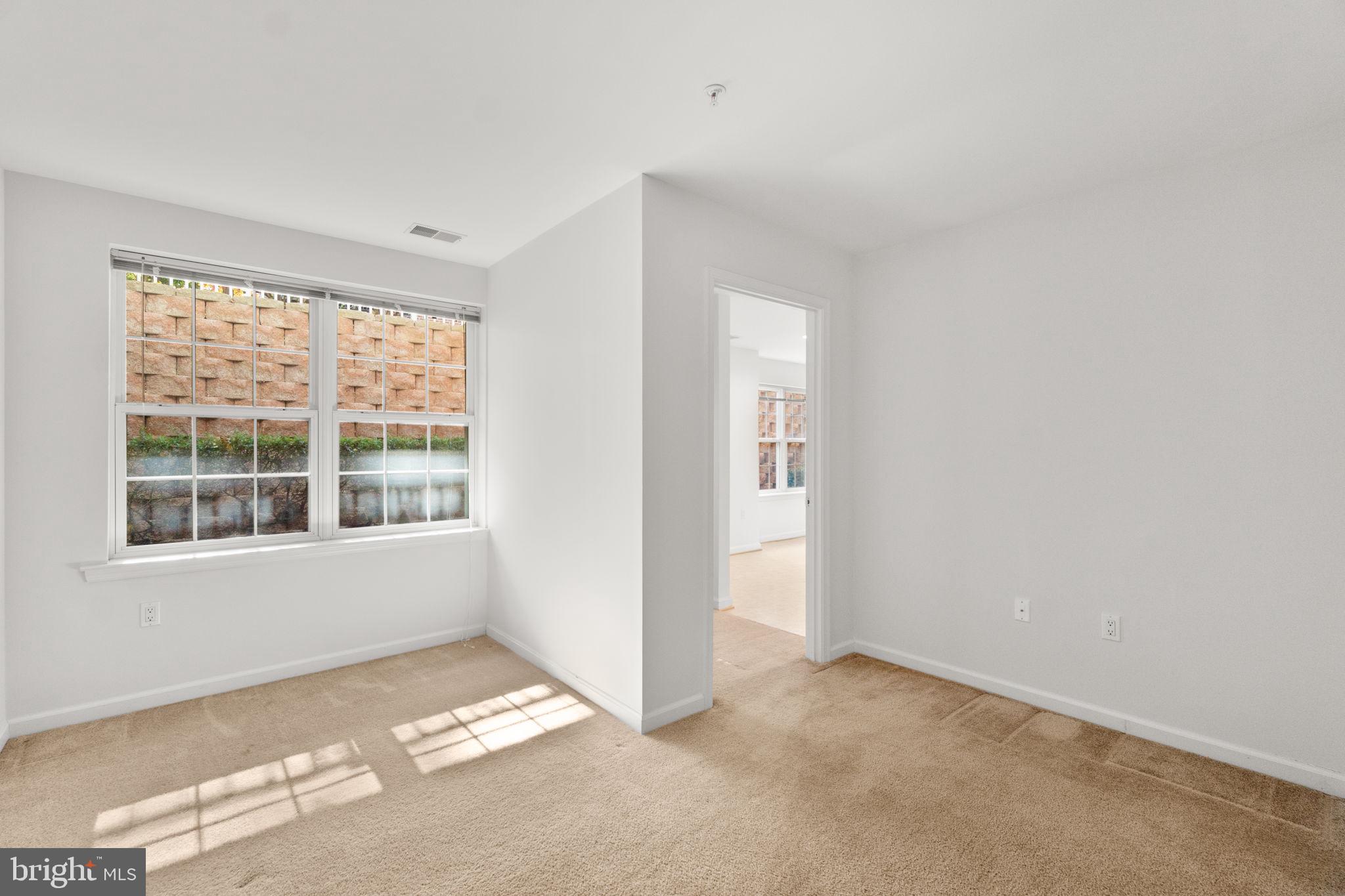 9510 Coyle Road, Unit 109 Owings Mills, MD 21117 - Photo 32 of 41 a view of an empty room with a window