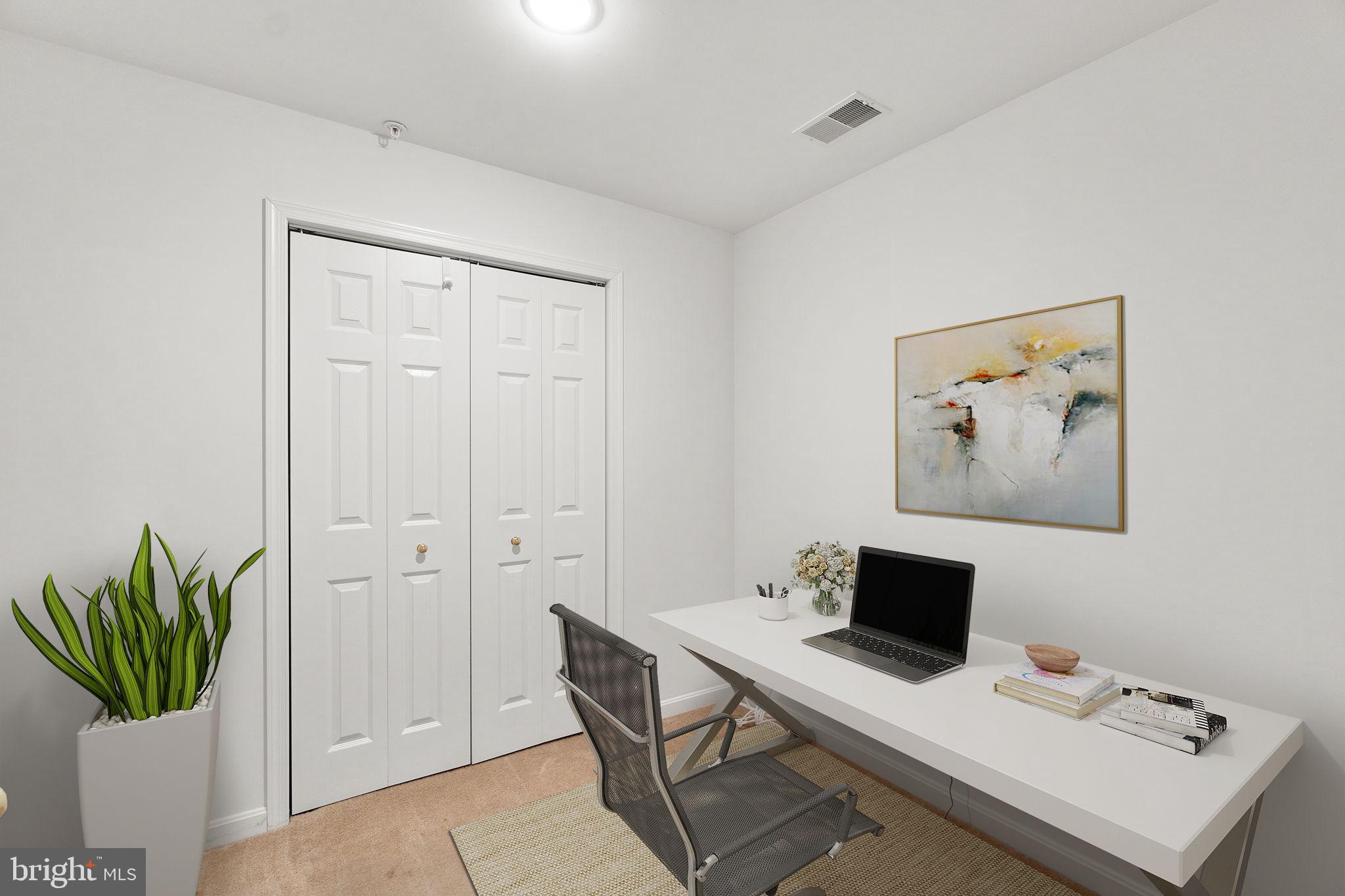 9510 Coyle Road, Unit 109 Owings Mills, MD 21117 - Photo 35 of 41 a view of a workspace with furniture and a potted plant