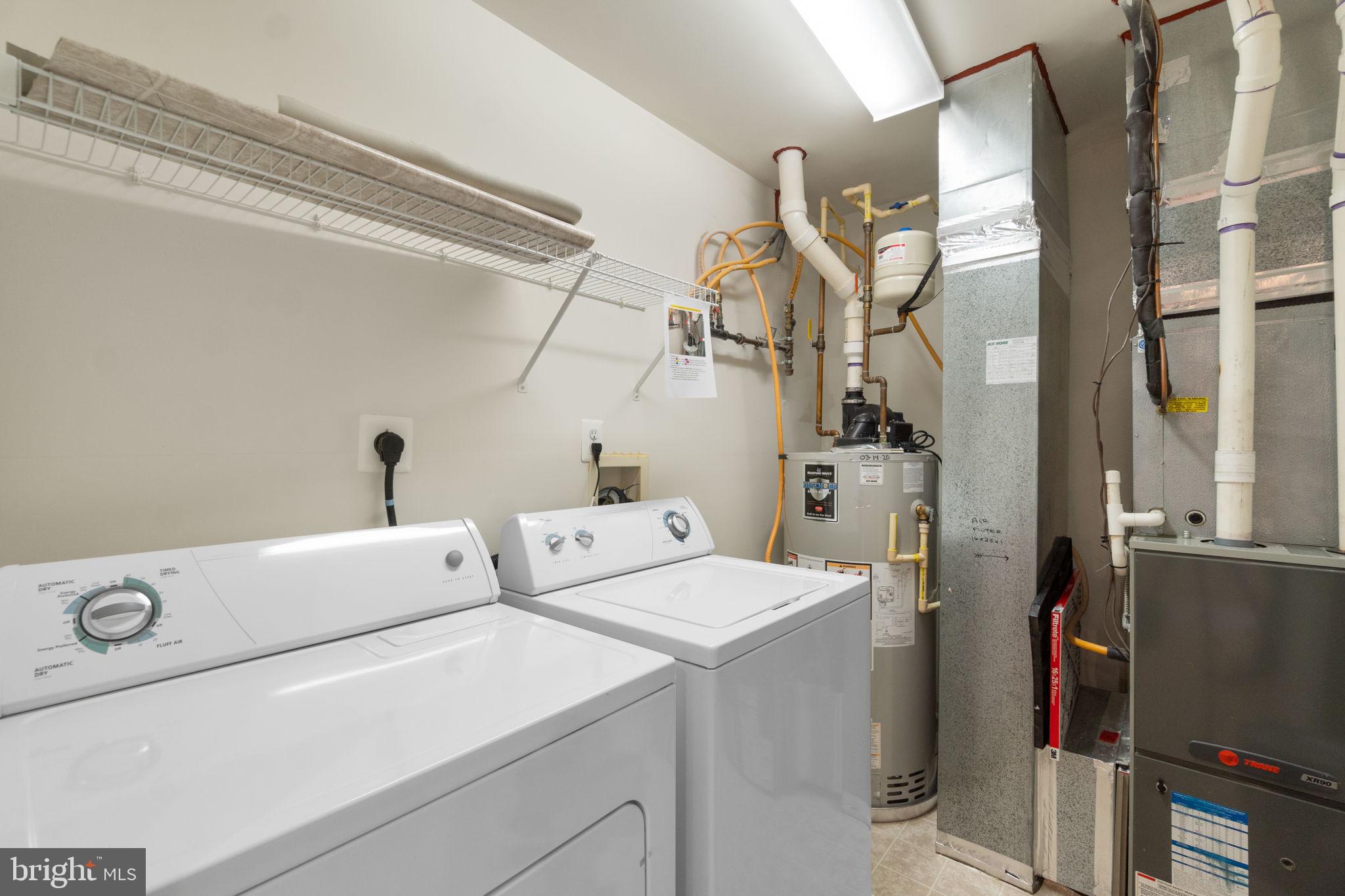 9510 Coyle Road, Unit 109 Owings Mills, MD 21117 - Photo 37 of 41 a utility room with dryer and washer