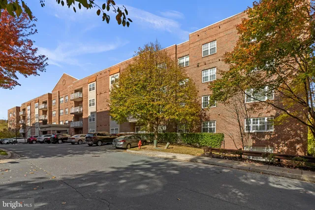 a city street lined with buildings and cars