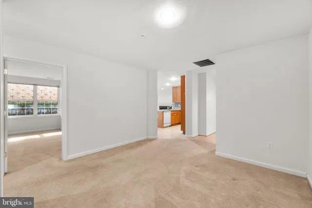 a view of a kitchen with a sink and a window