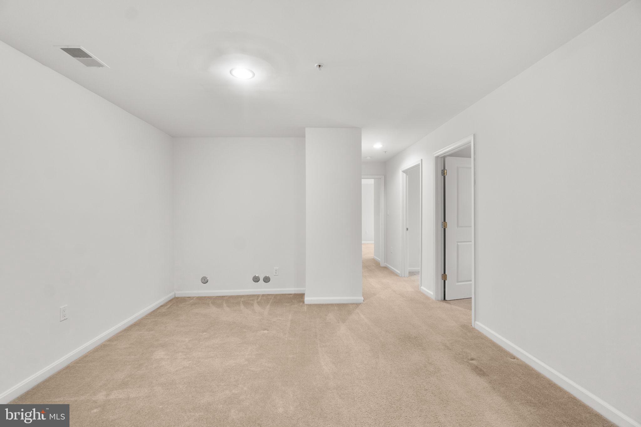 9510 Coyle Road, Unit 109 Owings Mills, MD 21117 - Photo 7 of 41 an empty room with an entryway