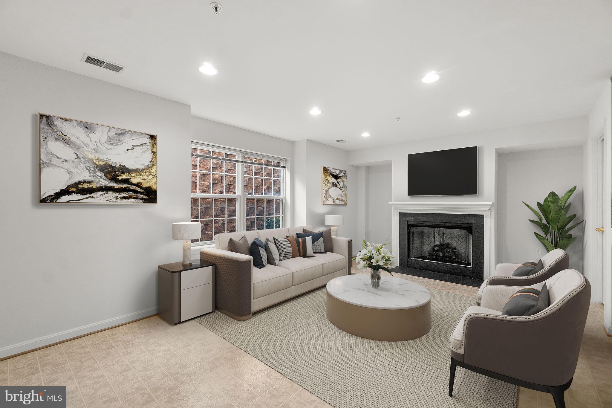 9510 Coyle Road, Unit 109 Owings Mills, MD 21117 - Photo 8 of 41 a living room with furniture a fireplace and a large window