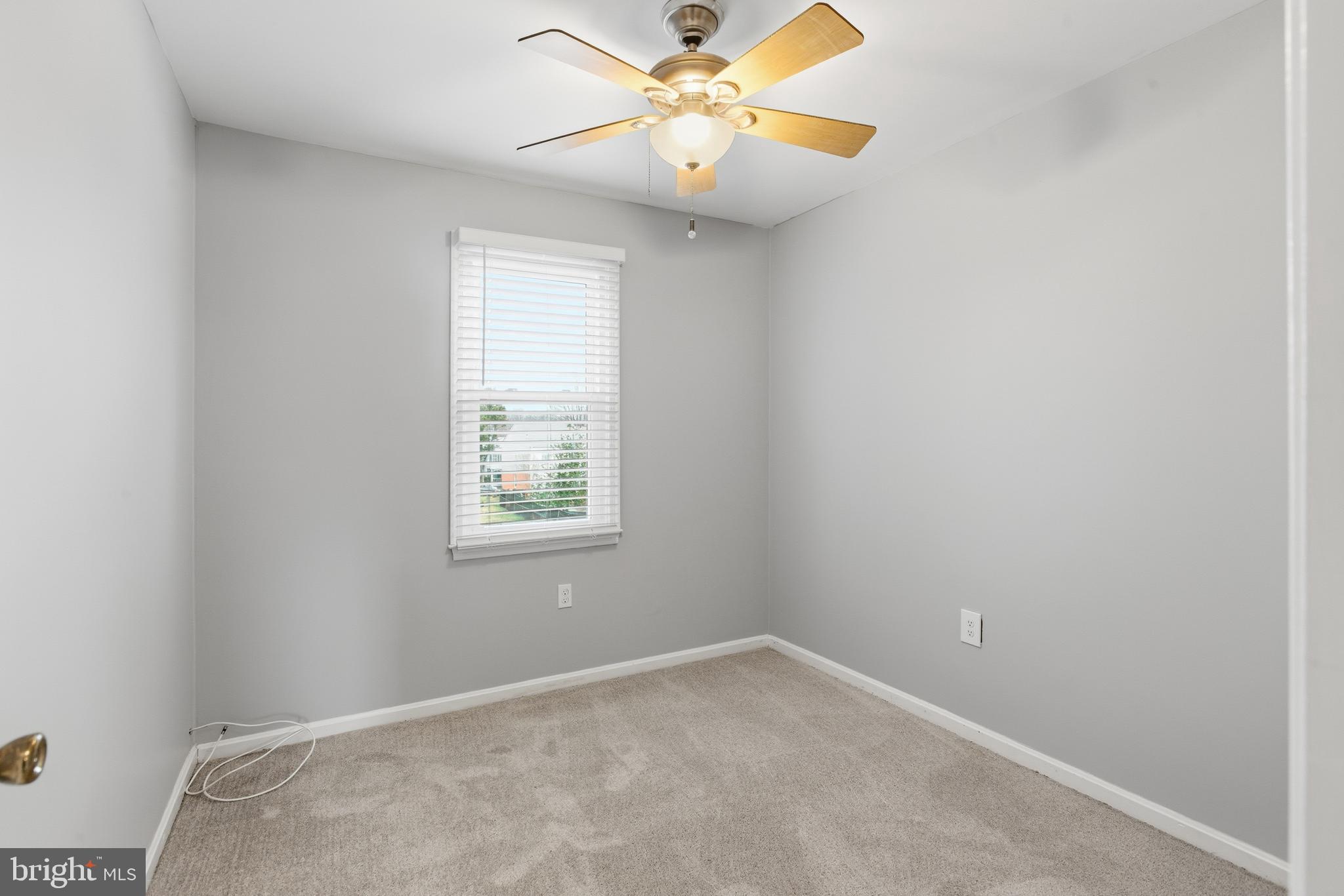 505 Montgomery Street Laurel, MD 20707 - Photo 19 of 30 an empty room with a window and a fan