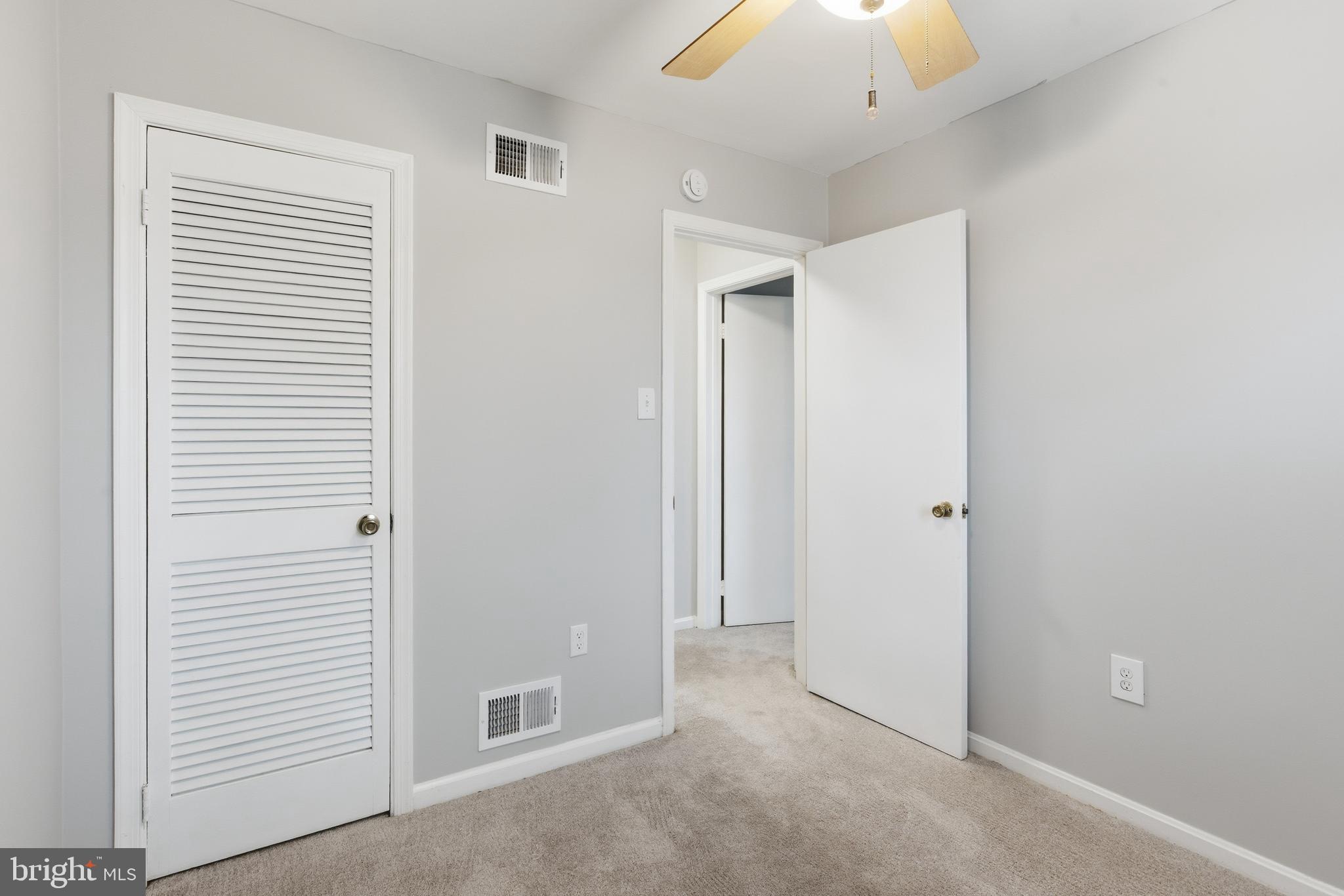 505 Montgomery Street Laurel, MD 20707 - Photo 20 of 30 a view of a hallway with a chandelier fan