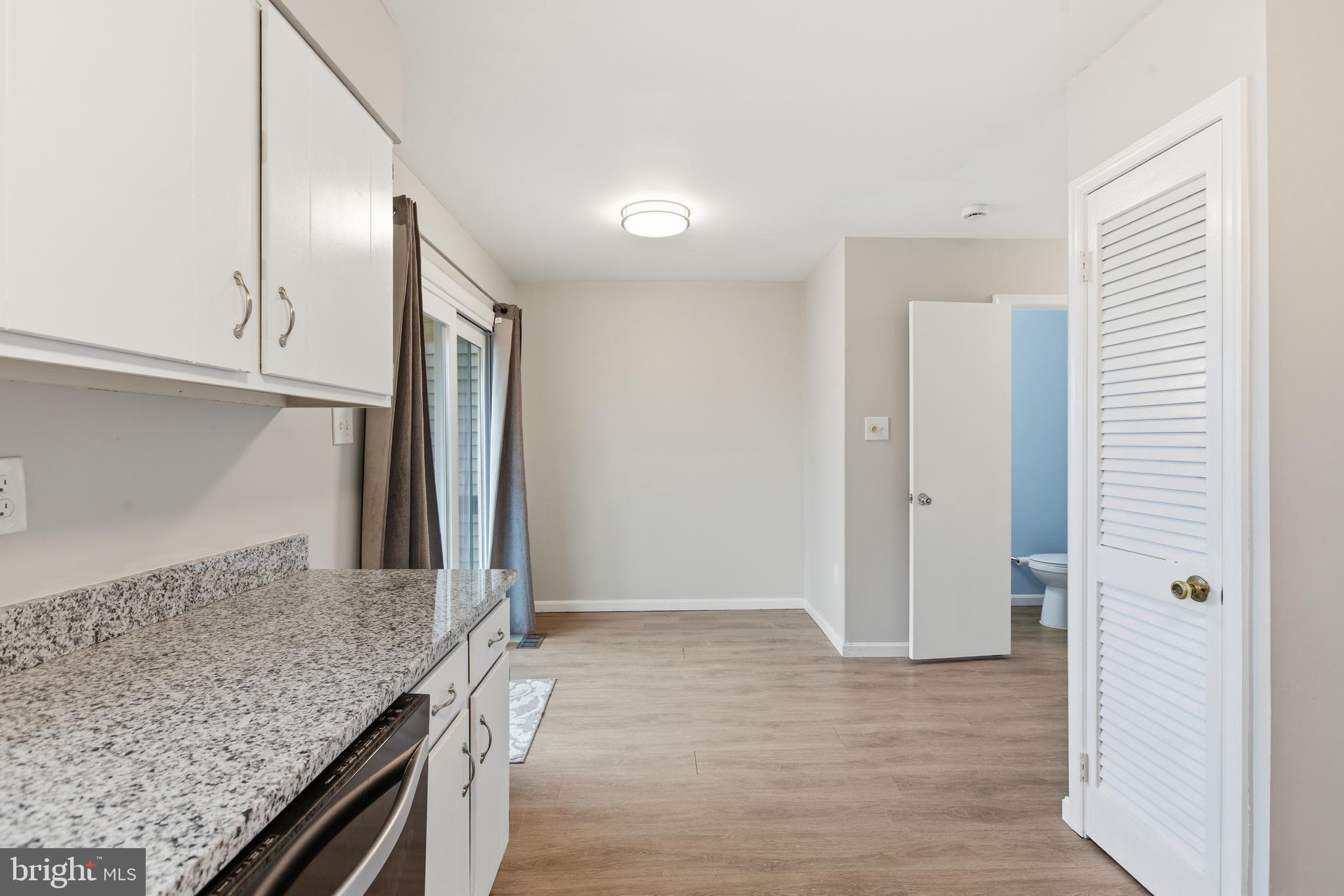 505 Montgomery Street Laurel, MD 20707 - Photo 9 of 30 a kitchen with stainless steel appliances granite countertop a refrigerator and a sink