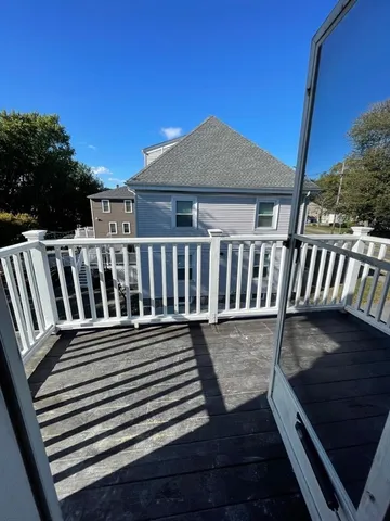 a view of a deck with a table and chairs