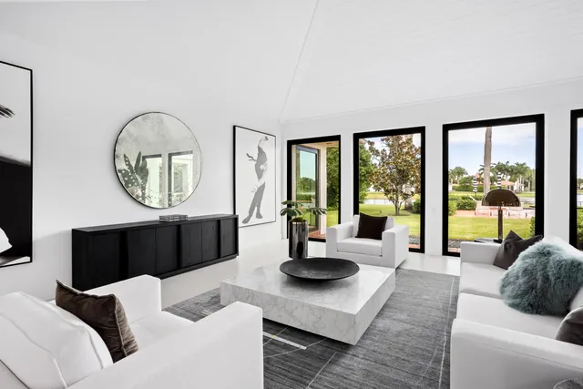 a living room with stainless steel appliances kitchen island granite countertop furniture and a view of kitchen