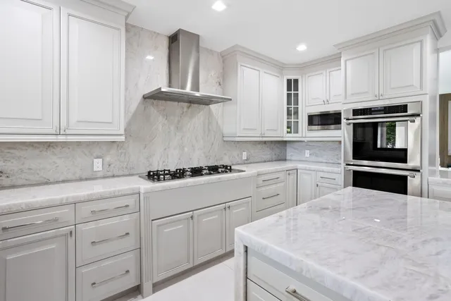 a very nice looking room with a large window and sitting space