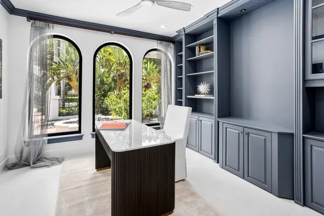 a bedroom with a large bed and a night stand