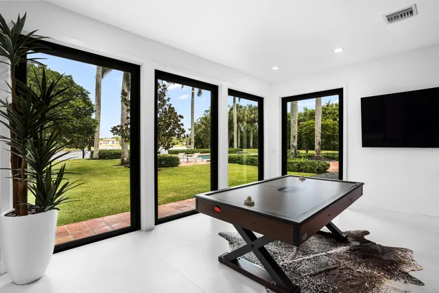 a bedroom with a large bed and a large window