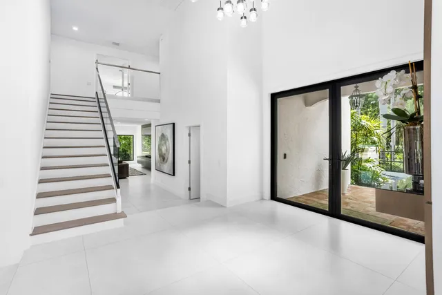 front view of a brick house with a yard