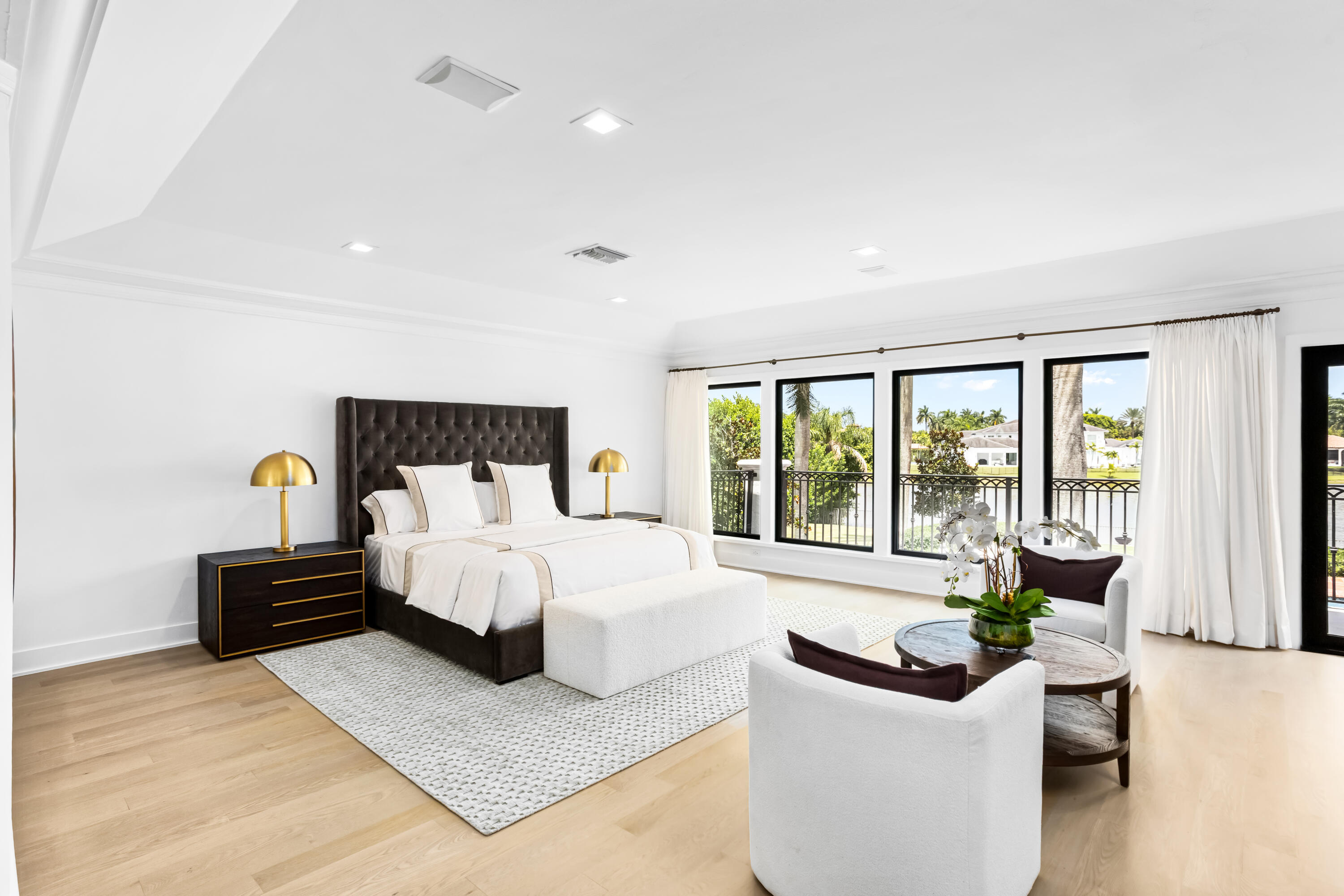 18743 Long Lake Drive Boca Raton, FL 33496 - Photo 42 of 85 a bedroom with a large bed and a large window