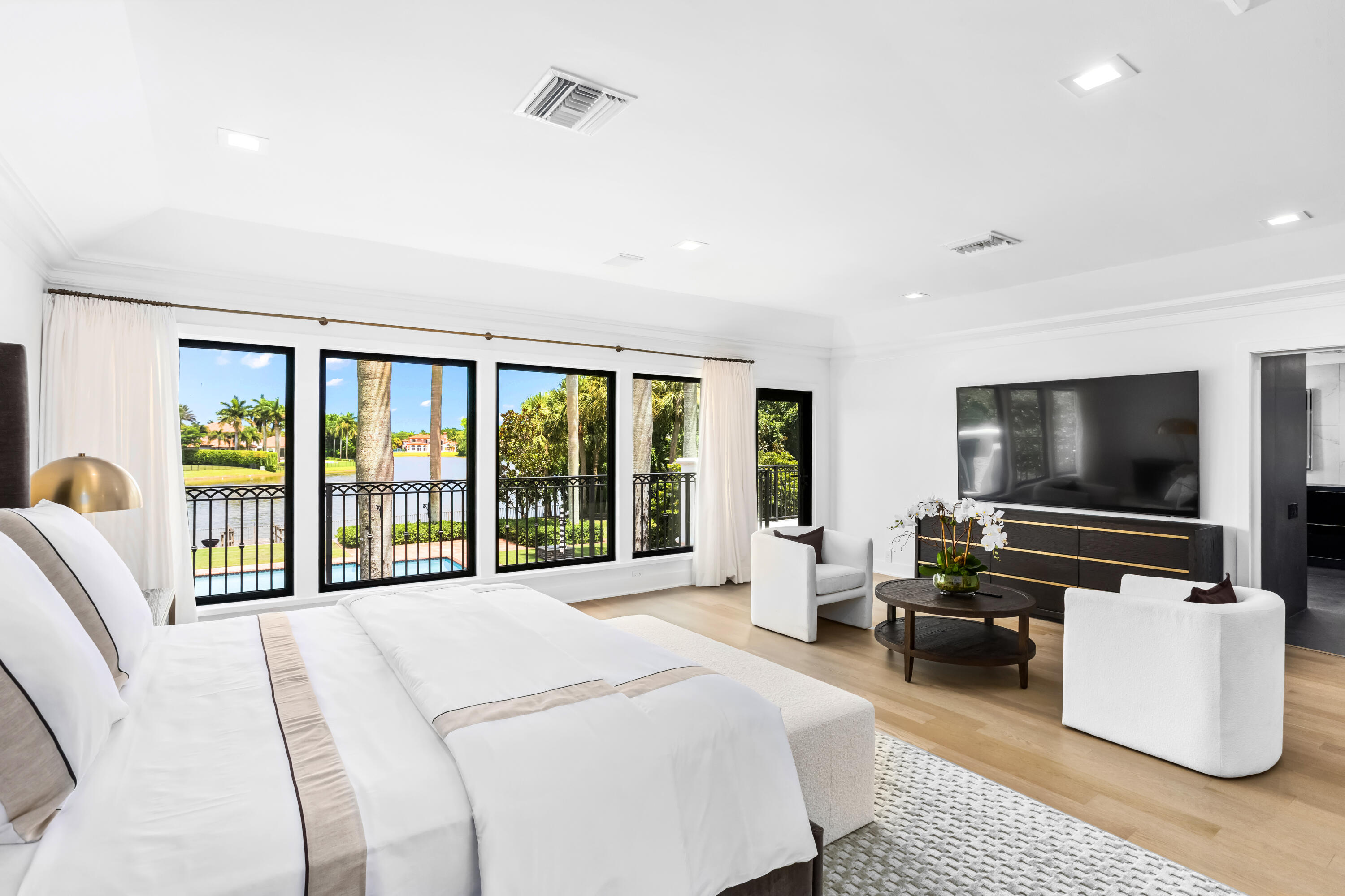 18743 Long Lake Drive Boca Raton, FL 33496 - Photo 43 of 85 a bedroom with furniture and a flat screen tv