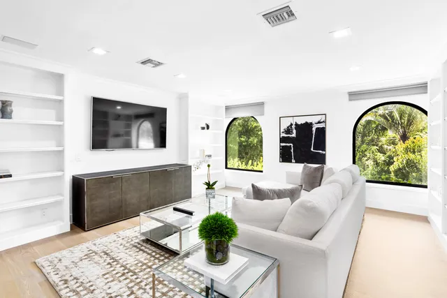 a view of a swimming pool with a table and chairs