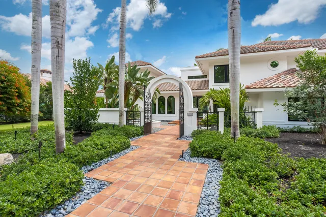 a front view of a house with garden