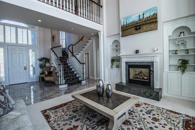 a living room with furniture and a fireplace
