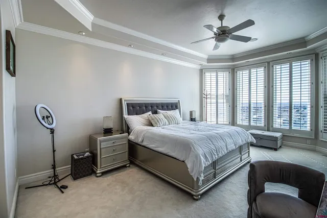 a spacious bedroom with a bed and a couch