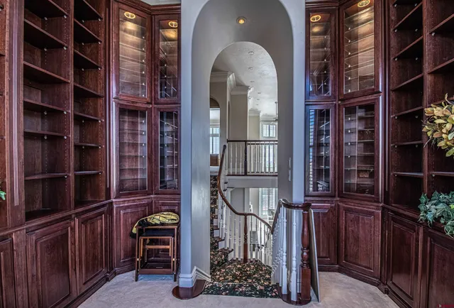 a view of entryway with a large window and potted plants