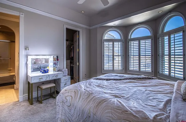 a bedroom with a bed and a view of bathroom