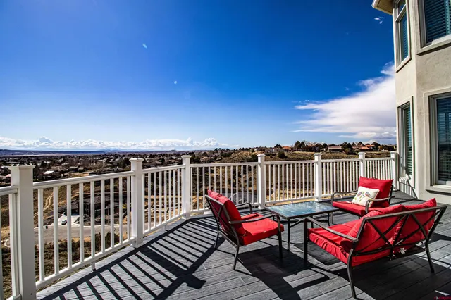 a view of a balcony with chairs