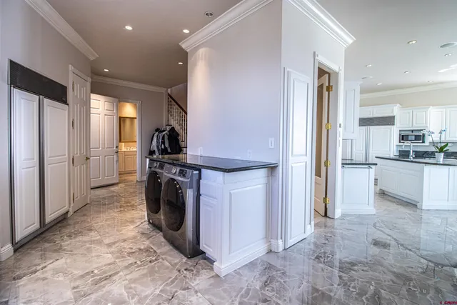 a kitchen with refrigerator a stove and cabinets