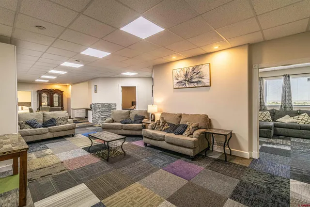 a living room with furniture and a table